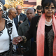 Winnie Madikizela-Mandela, right, leaves after speaking to the press outside Nelson Mandela's home. (Dan Kitwood/Getty Images)